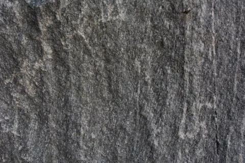 The texture of natural stone is light gray. Stock Photos