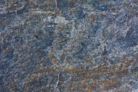 The texture of natural stone is light gray. Stock Photos