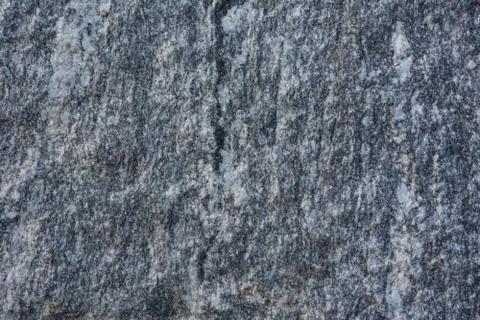 The texture of natural stone is light gray. Stock Photos