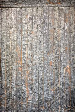 Texture of old after the fire charred wooden gate. Stock Photos