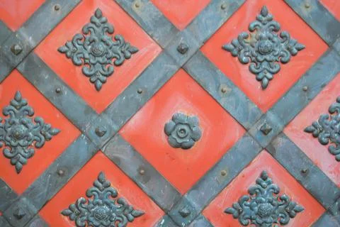 Texture of an old ancient medieval red antique sturdy iron metal door with ri Photos