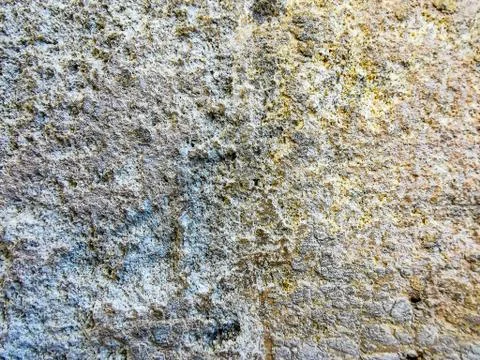 Texture of old and damaged stone wall with colored stains for design, backgro Stock Photos