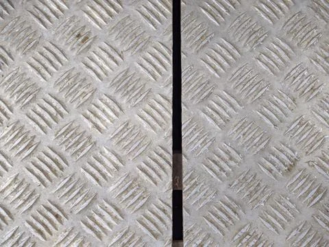 Texture of old and rusty checker plate aluminum sheet Stock Photos