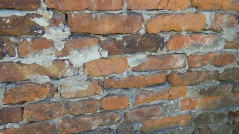 Texture of a old and torn surface of brick red wall Stock Footage 79524594