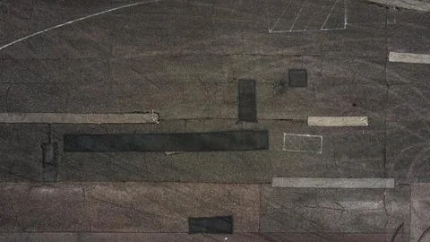 The texture of old and worn out asphalt. Drone view of old road Stock Photos