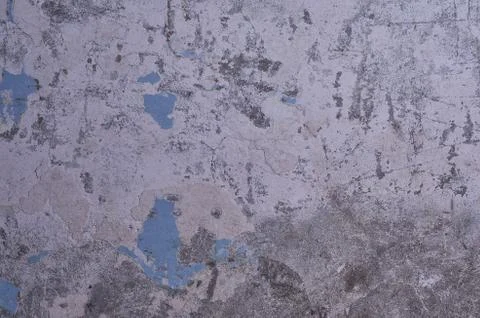 Texture of the old battered wall blue peeling paint, concrete, gray cement gr Stock Photos