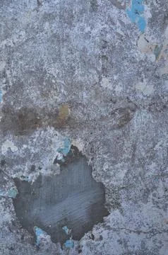 Texture of the old battered wall blue peeling paint, concrete, gray cement gr Stock Photos