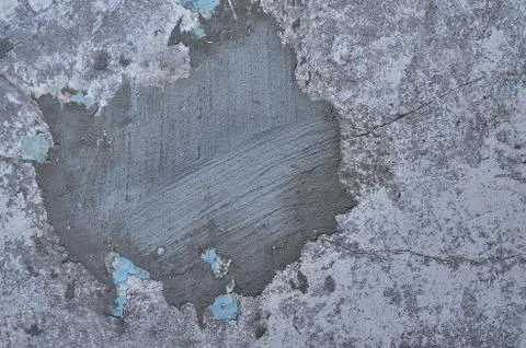 Texture of the old battered wall blue peeling paint, concrete, gray cement gr Stock Photos