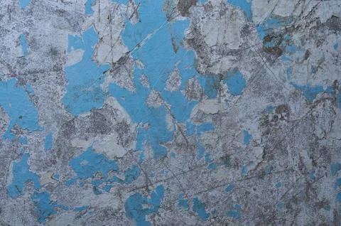 Texture of the old battered wall blue peeling paint, concrete, gray cement gr Stock Photos