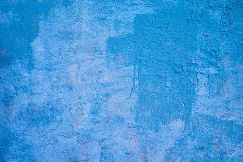 The texture of an old blue painted wall. rough background. Stock Photos