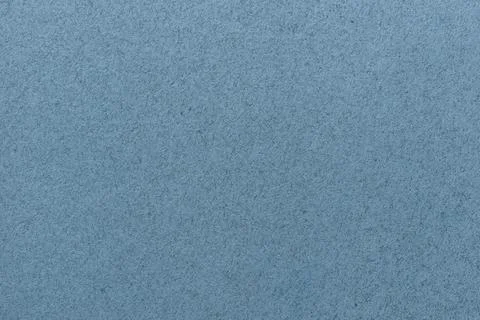 Texture of old blue paper. Structure of cardboard wallpaper. Denim background Stock Photos