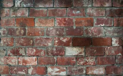 The texture of the old brick facade of red brick . Stock Photos