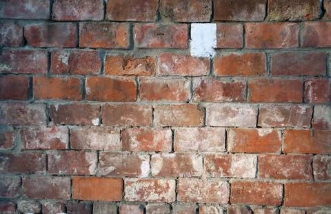 The texture of the old brick facade of red brick . Stock Photos