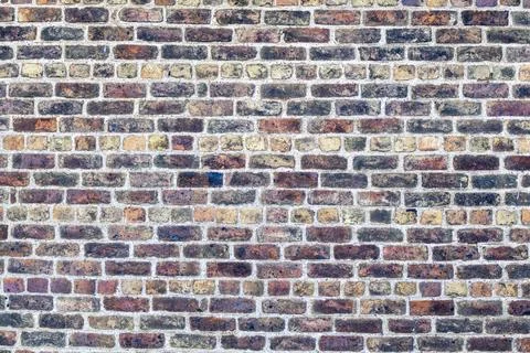 Texture of old brick wall of an ancient building. Red and orange masonry of.. Stock Photos