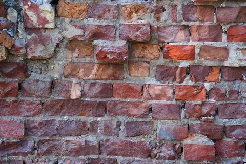 The texture of old brick wall in close-up. Stock Photos