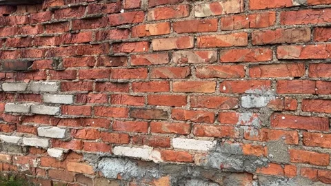 Texture of old brick wall with cracked mortar and concrete patches Stock Footage 337359928