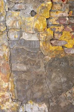 The texture of an old brick wall with cracks. The aesthetics of destruction. Stock Photos