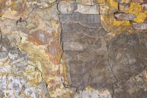 The texture of an old brick wall with cracks. The aesthetics of destruction. Stock Photos