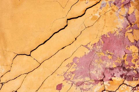 The texture of an old brick wall with cracks. The aesthetics of destruction. Stock Photos
