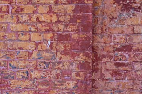 The texture of an old brick wall with cracks. The aesthetics of destruction. Stock Photos