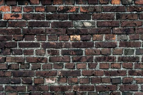 Texture of an old brick wall, dark grunge background Stock Photos