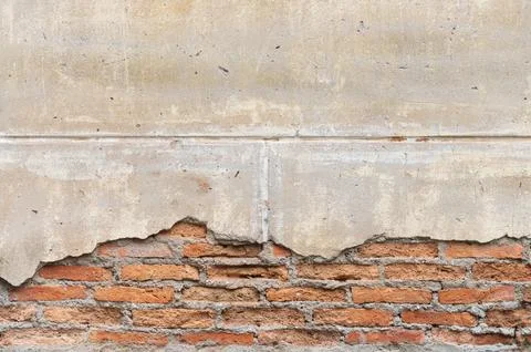 Texture of an old brick wall with fallen plaster Stock Photos