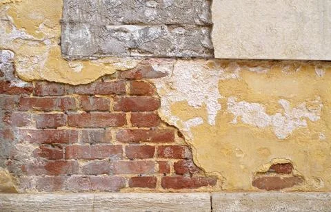 Texture of an old brick wall. Old red brick clay wall with on a sunny day. Cl Stock Photos