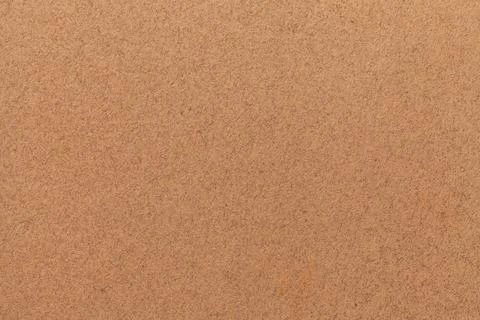 Texture of old brown paper. Structure of a matte dense cardboard wallpaper. Stock Photos