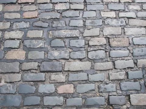 Texture of old cobblestone pavement Stock Photos