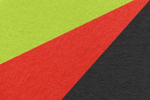 Texture of old craft green, red and black color paper background, macro. Foto stock