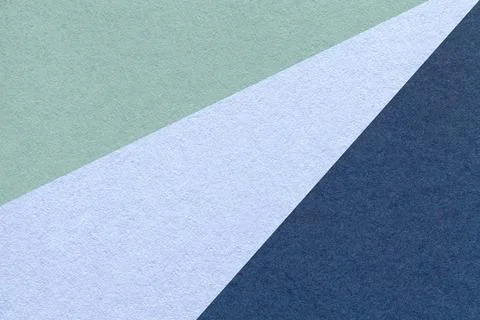 Texture old craft green, sky and navy blue paper background, macro. Stockfoto's