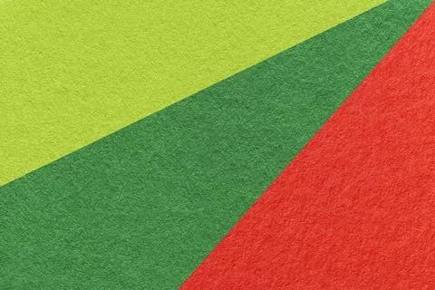 Texture of old craft olive, red and light green color paper background, macro Stock Photos