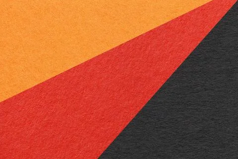 Texture of old craft red, black and orange color paper background, macro. Foto stock