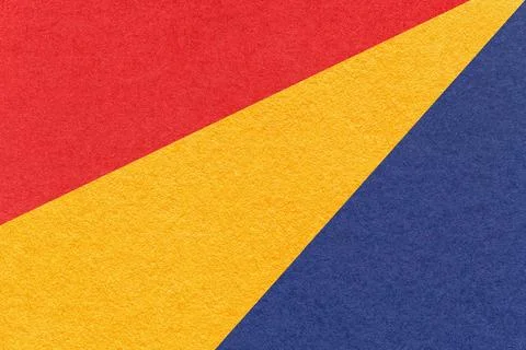 Texture of old craft red, yellow and navy blue color paper background, macro Foto stock