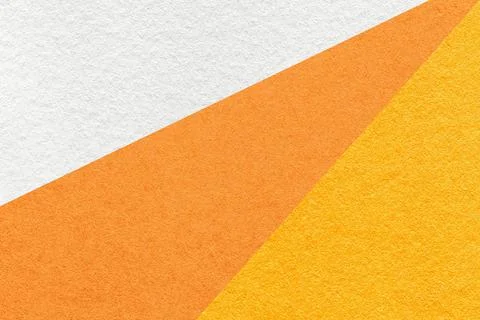 Texture of old craft white, orange and yellow color paper background, macro Stock Photos