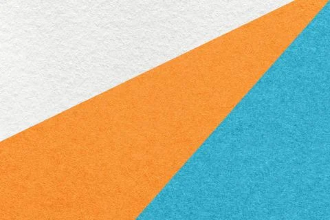Texture of old craft white, orange and turquoise color paper background, macr Stock Photos