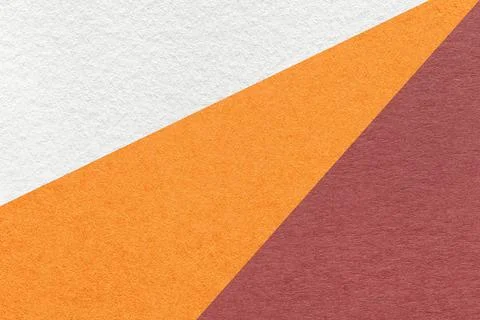 Texture of old craft white, orange and maroon color paper background, macro. Stock Photos