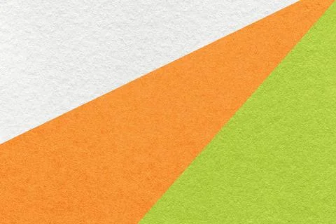 Texture of old craft white, orange and green color paper background, macro Stock Photos