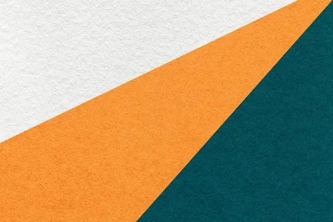 Texture old craft white, orange and emerald paper background, macro. Stock Photos