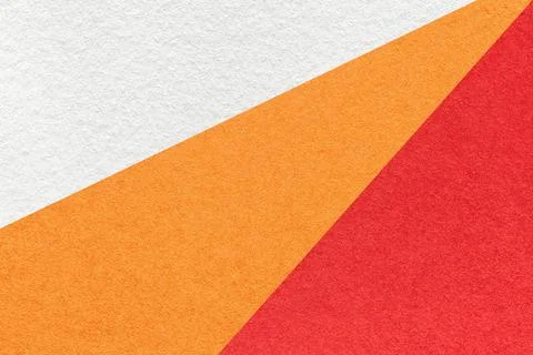 Texture of old craft white, red and orange color paper background, macro. Stock Photos