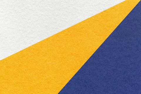 Texture of old craft white, yellow and navy blue color paper background, macr Foto stock