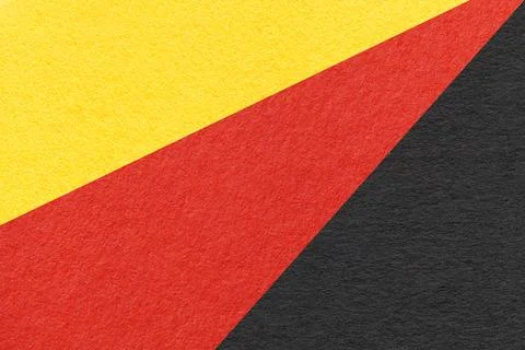 Texture of old craft yellow, red and black color paper background, macro. Foto stock