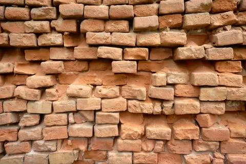 Texture of an old crumbling brick wall. Stock Photos