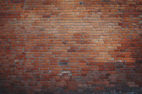 Texture of old dark brown and red brick wall . Grunge construction texture .. Stock Photos