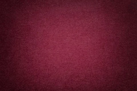 Texture of old dark red paper background, closeup. Structure of dense cardboa 写真素材