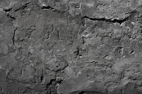 Texture of old gray concrete wall with plaster close-up. Stock Photos