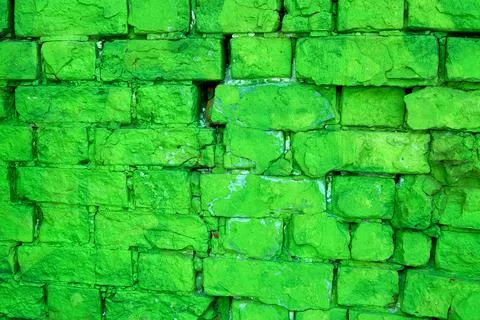The texture of an old green brick wall. Close-up, pattern. Stock Photos
