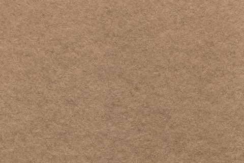 Texture of old light brown paper background, closeup. Structure of dense card Stock Photos