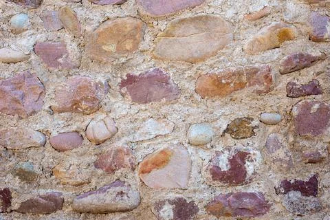 Texture of old masonry with stones of different sizes Stock Photos