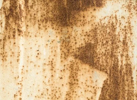Texture old metal surface painted beige paint with rust Stock Photos